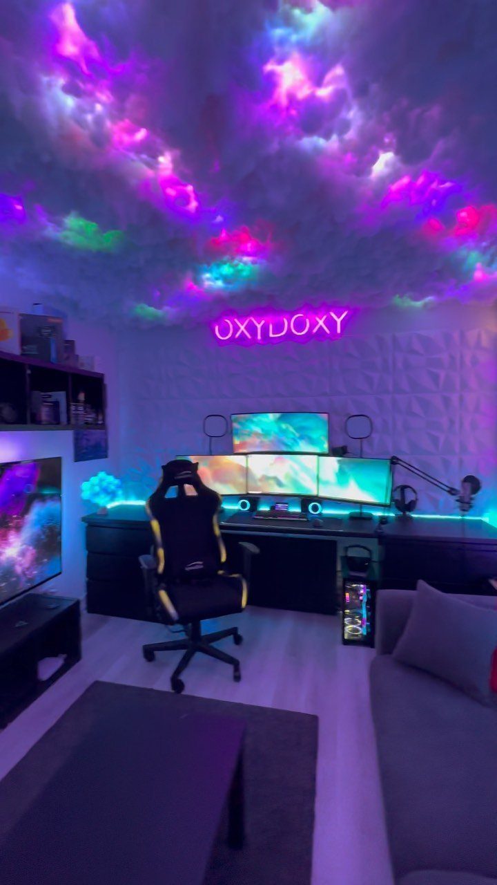 Gaming room with cloud ceiling, neon lights, triple monitor setup, and gaming chair.