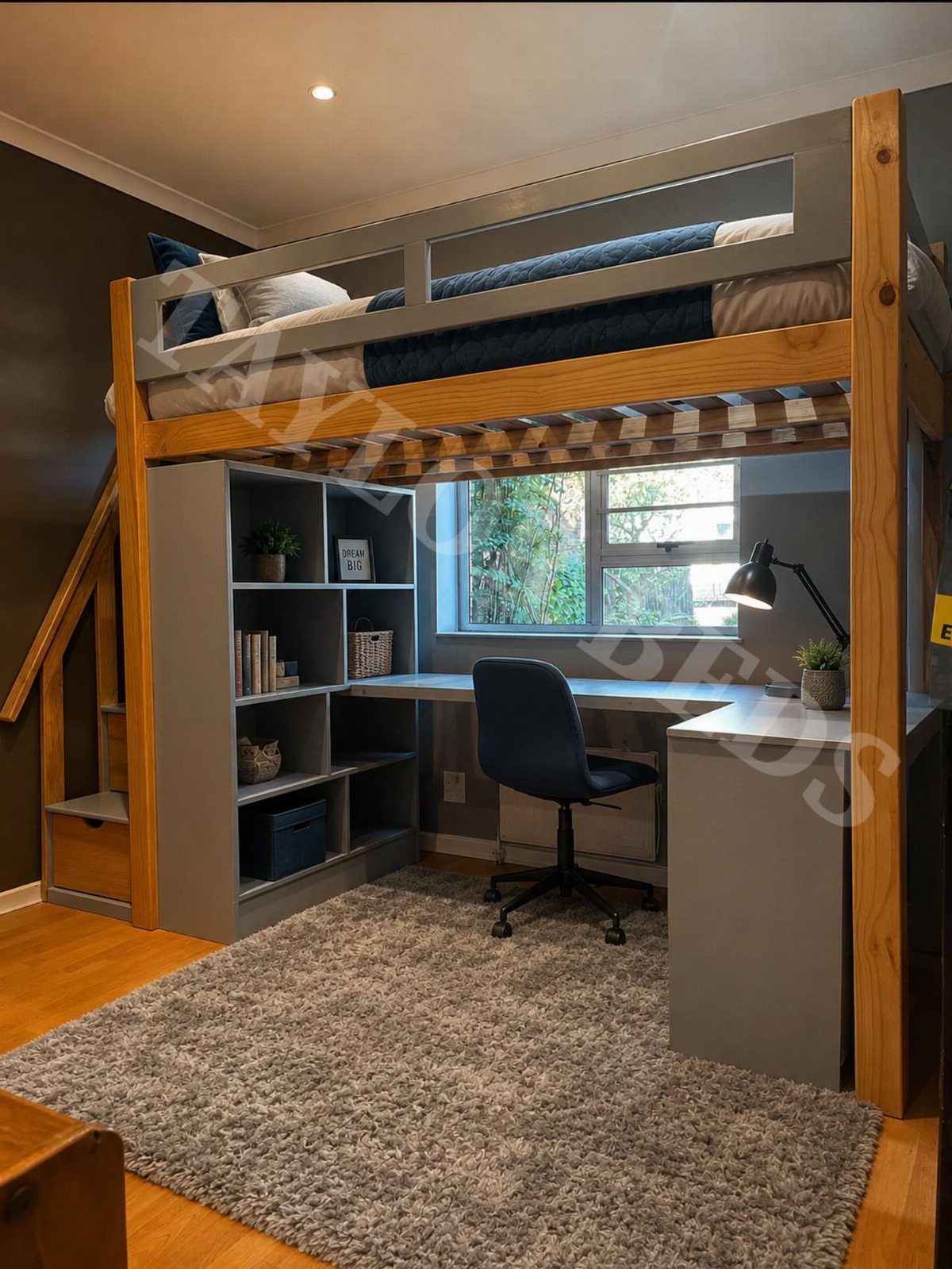 Loft bed with a grey desk and shelving unit underneath in a bedroom