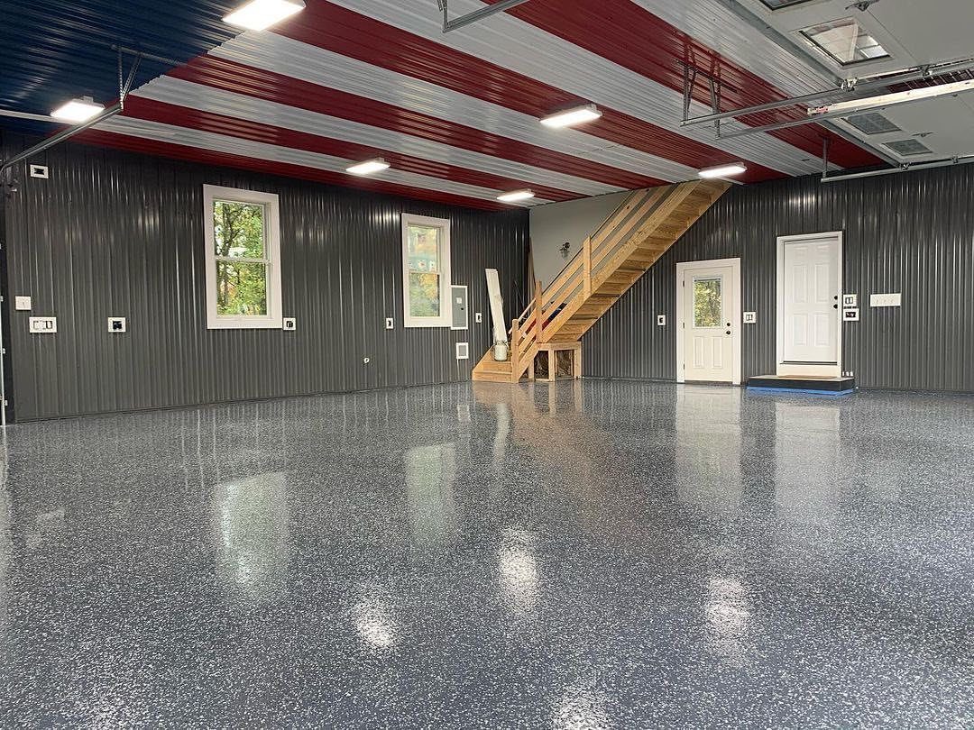 Corrugated metal ceiling with red and white stripes in a modern garage space