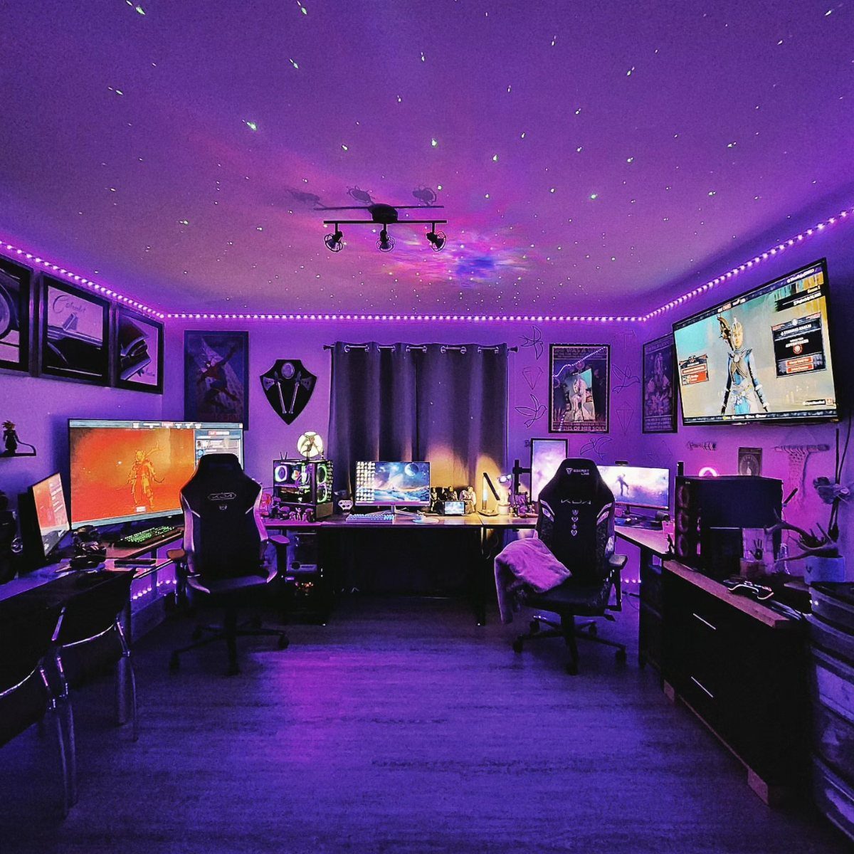 Gaming room with purple LED lighting and a star-filled projector ceiling setup.