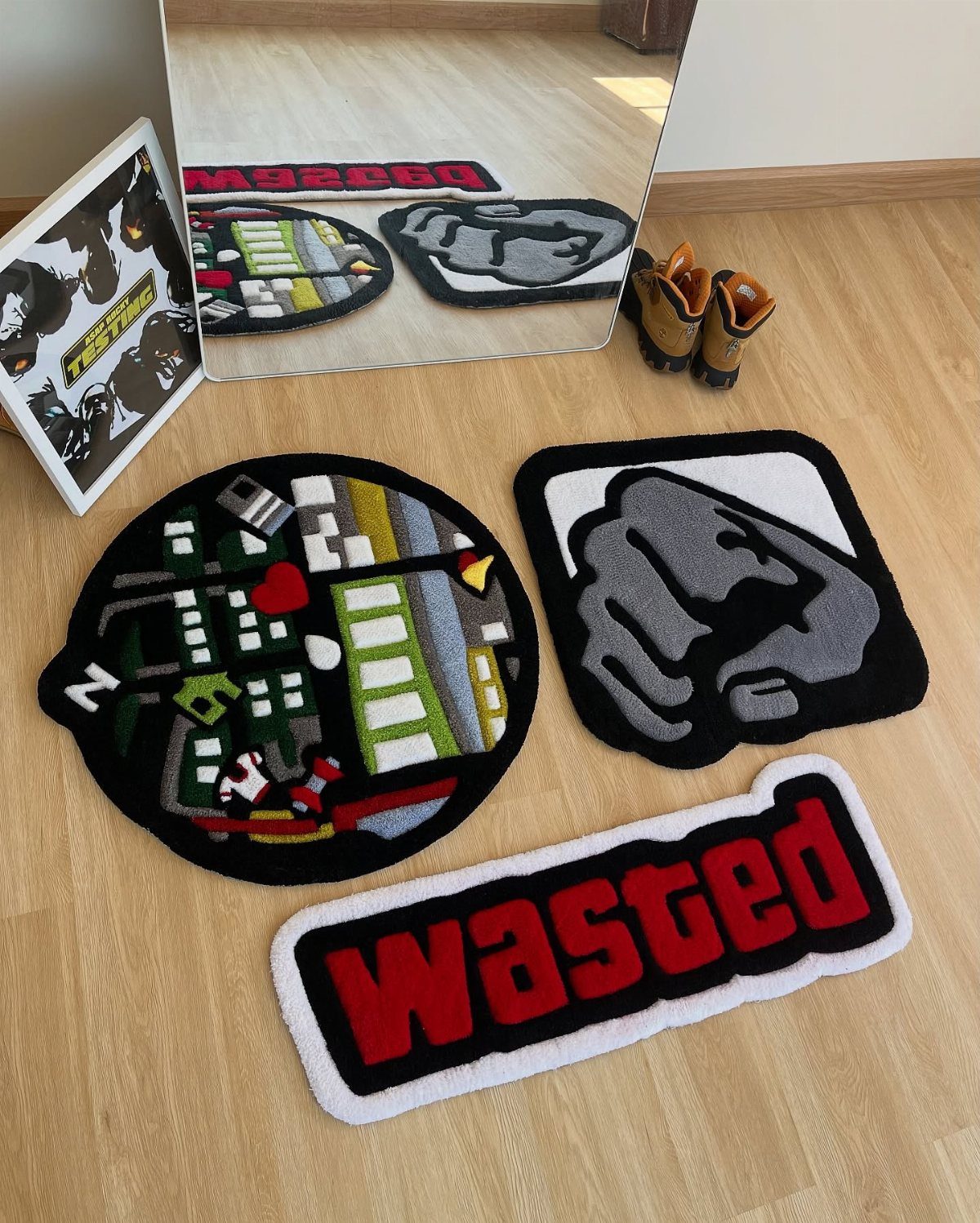 Three gaming-themed rugs featuring a city, a fist, and the word Wasted.