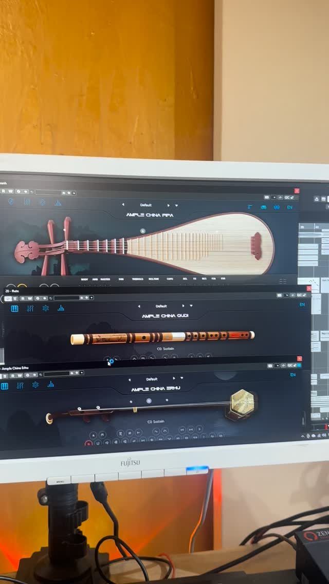Computer monitor displaying three virtual instrument software plugins for traditional Chinese music.