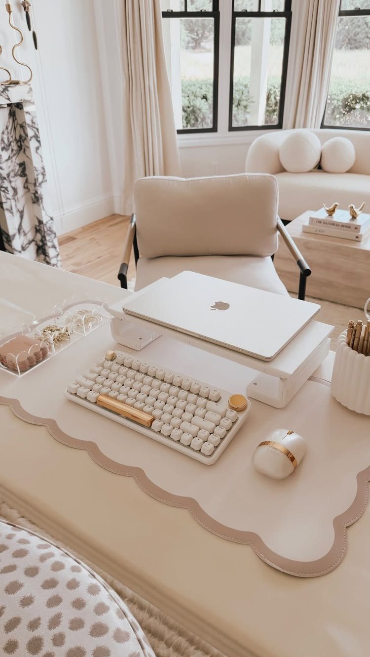 Scalloped beige desk mat with white keyboard, mouse, and laptop on a desk.