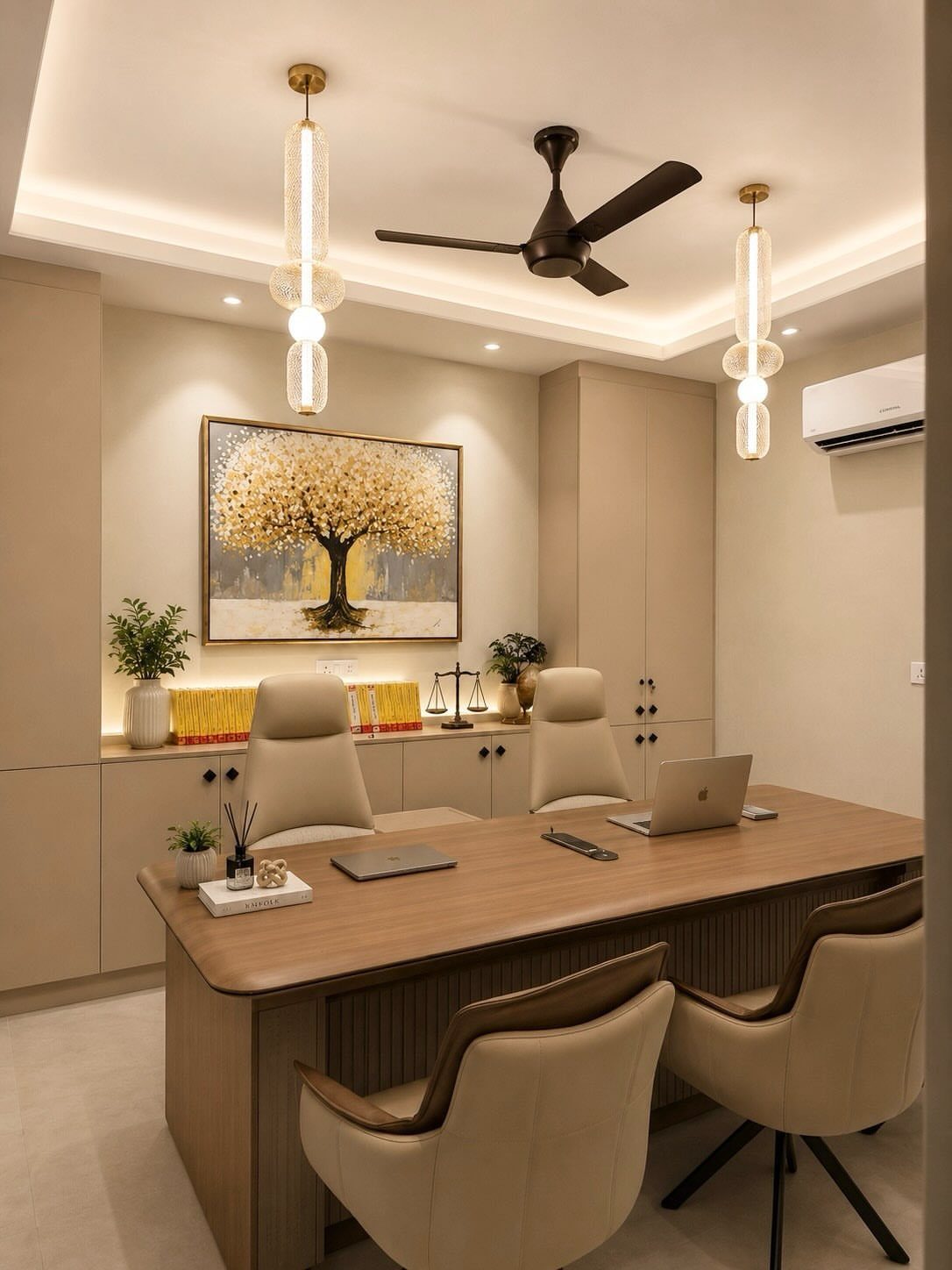 Beige and brown home office with a wooden desk and matching leather chairs.