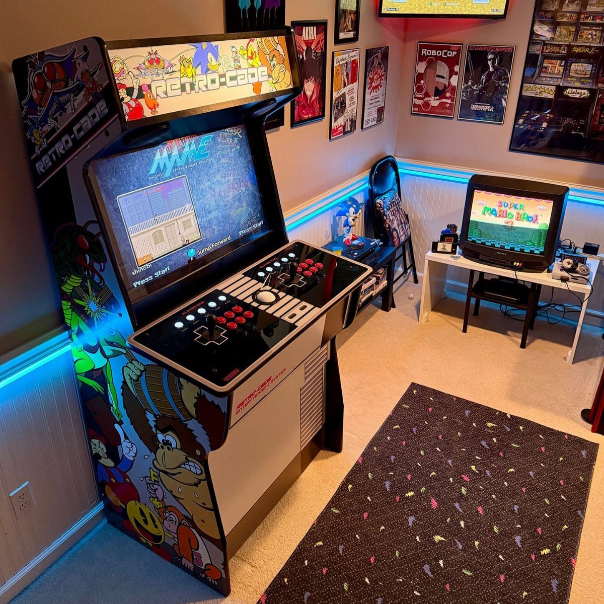 Retro arcade machine with colorful graphics in a man cave with neon lighting.