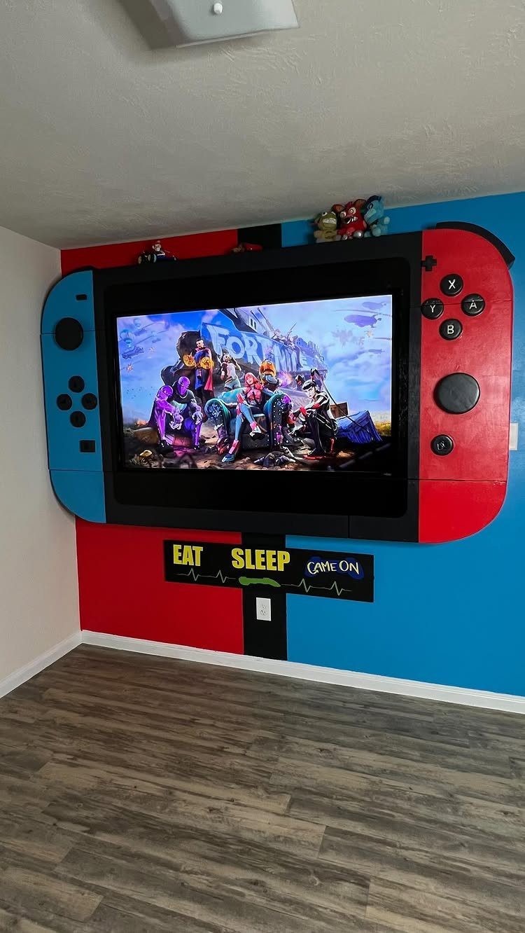 Television framed by a large Nintendo Switch border on a red and blue wall