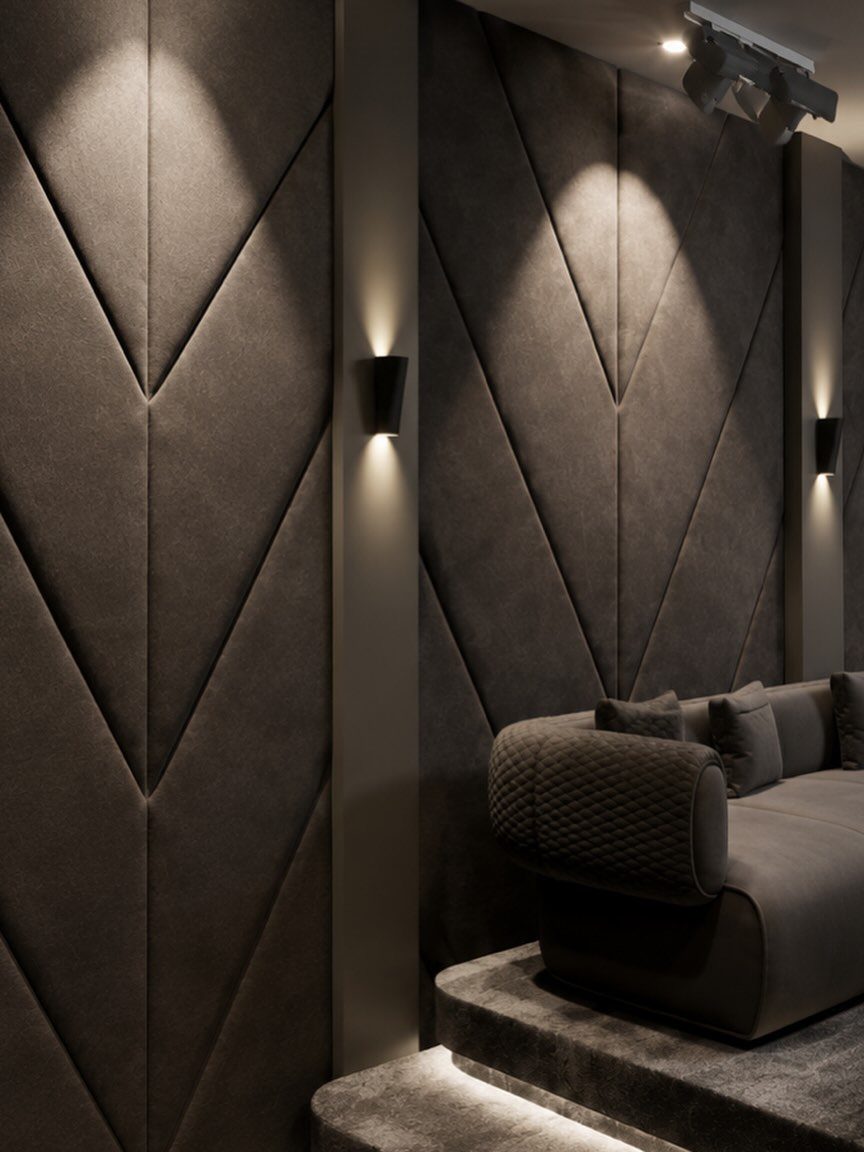 Geometric velvet acoustic wall panels in a dark luxury home cinema room