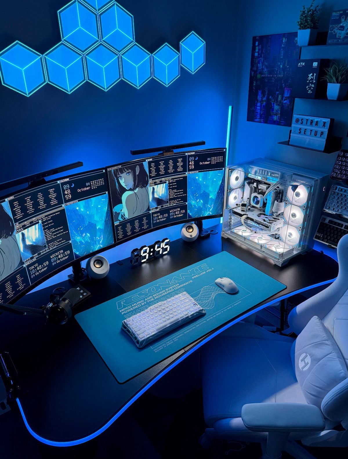 Gaming setup with three monitors, blue neon hexagonal wall lights, and white chair.