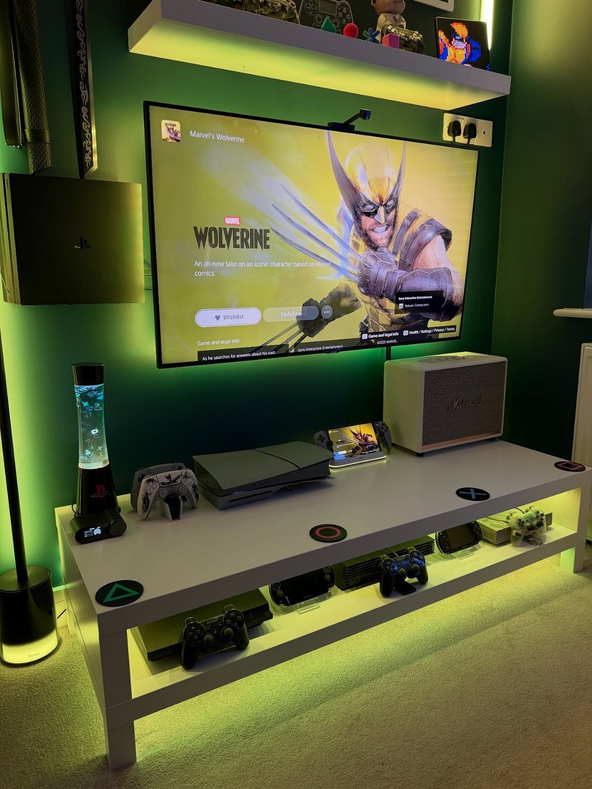 Gaming setup with a large TV, PS5 console, and white LED-lit table.