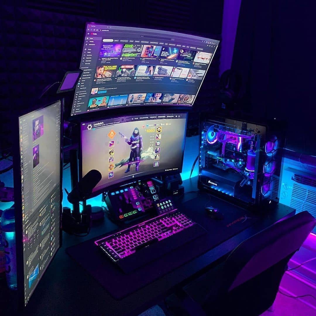 Gaming setup with triple monitors and RGB lighting in a dark purple room