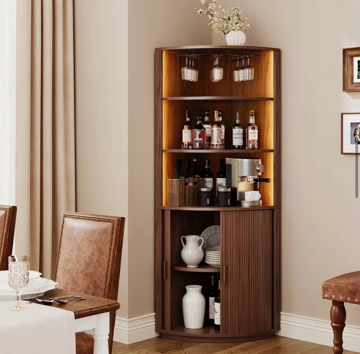 Curved brown wooden corner bar cabinet with liquor bottles and wine storage