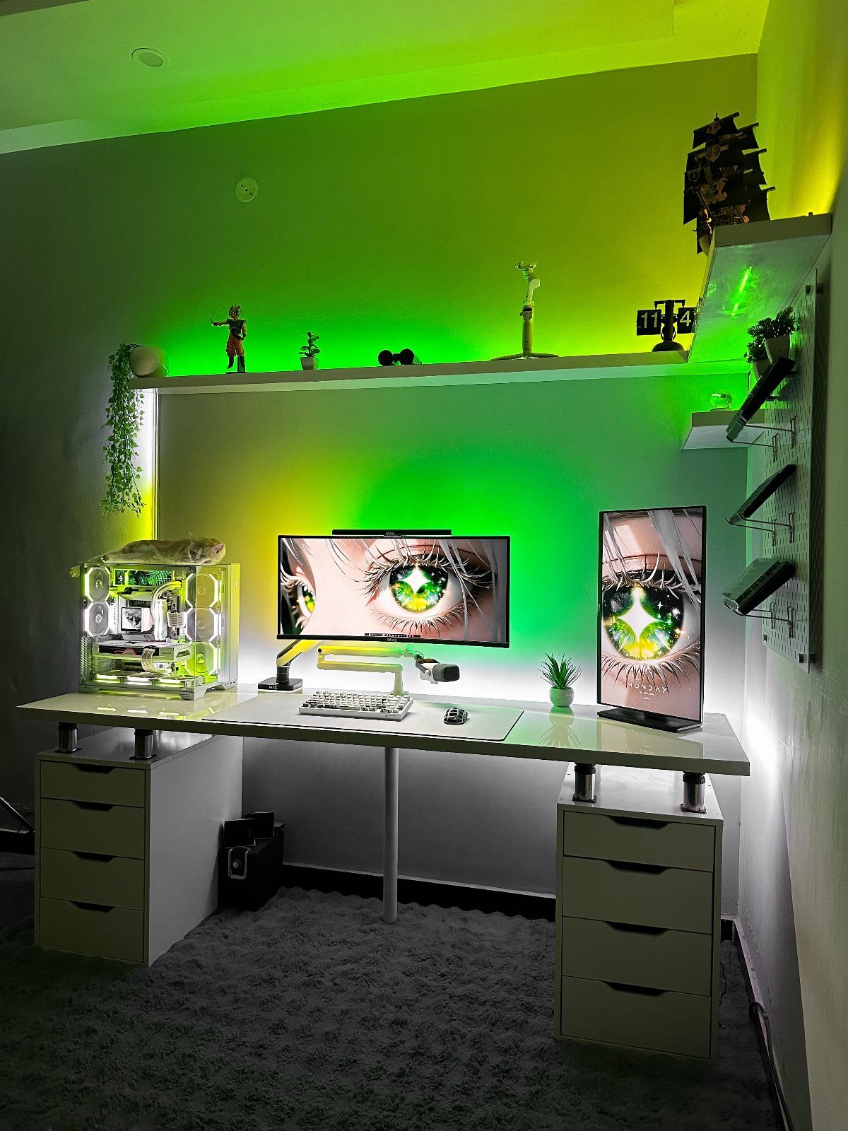 Gaming setup with dual monitors and green LED lighting in a small room