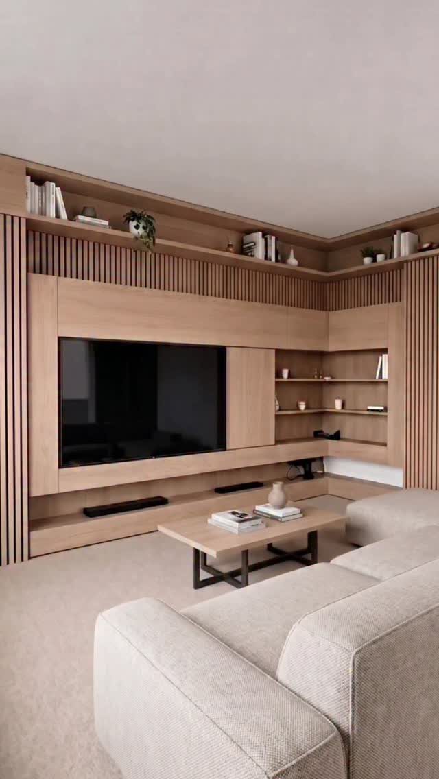 Modern media room with light wood wall paneling, large TV, and neutral sofa.