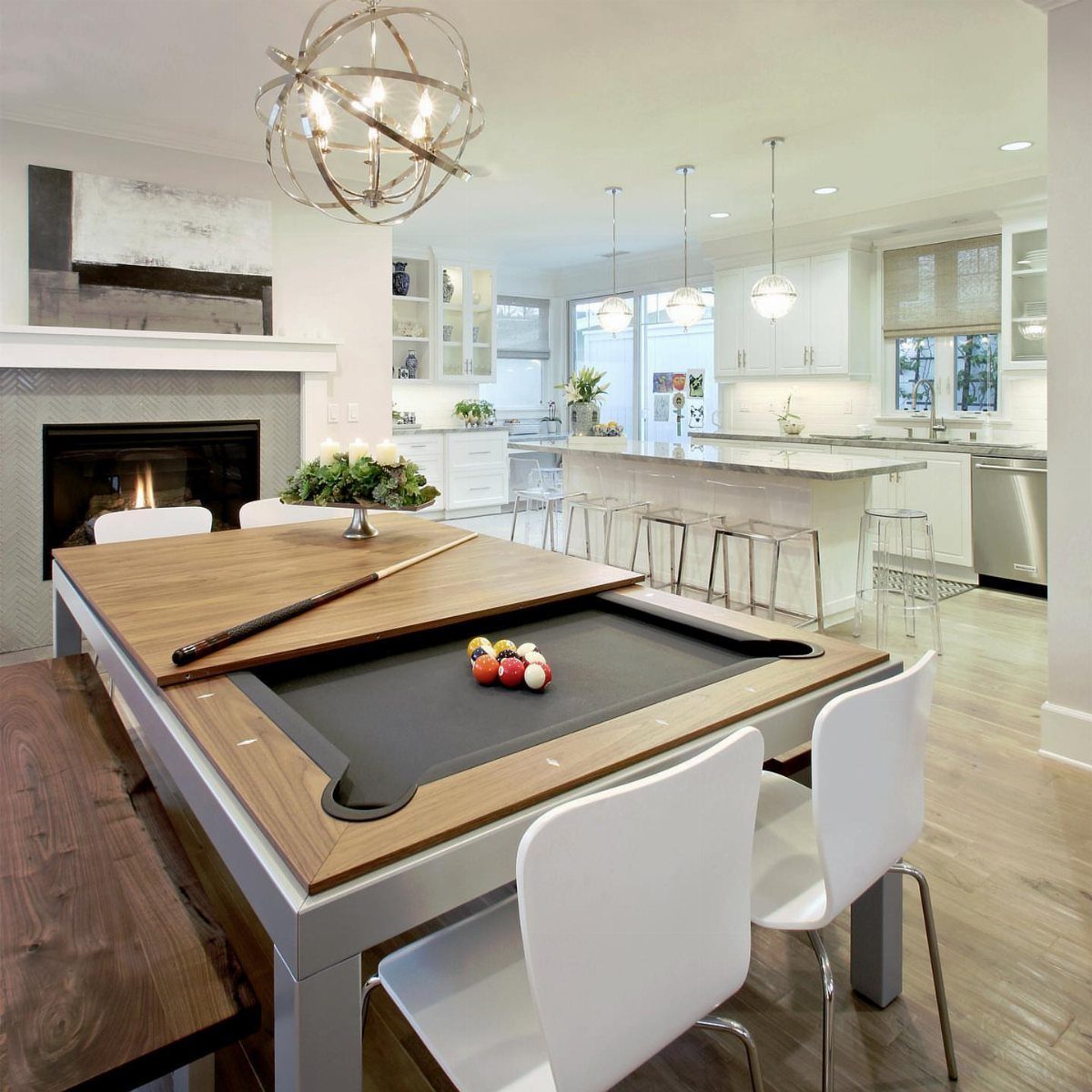 Convertible dining table with a built-in small pool table in a modern room.
