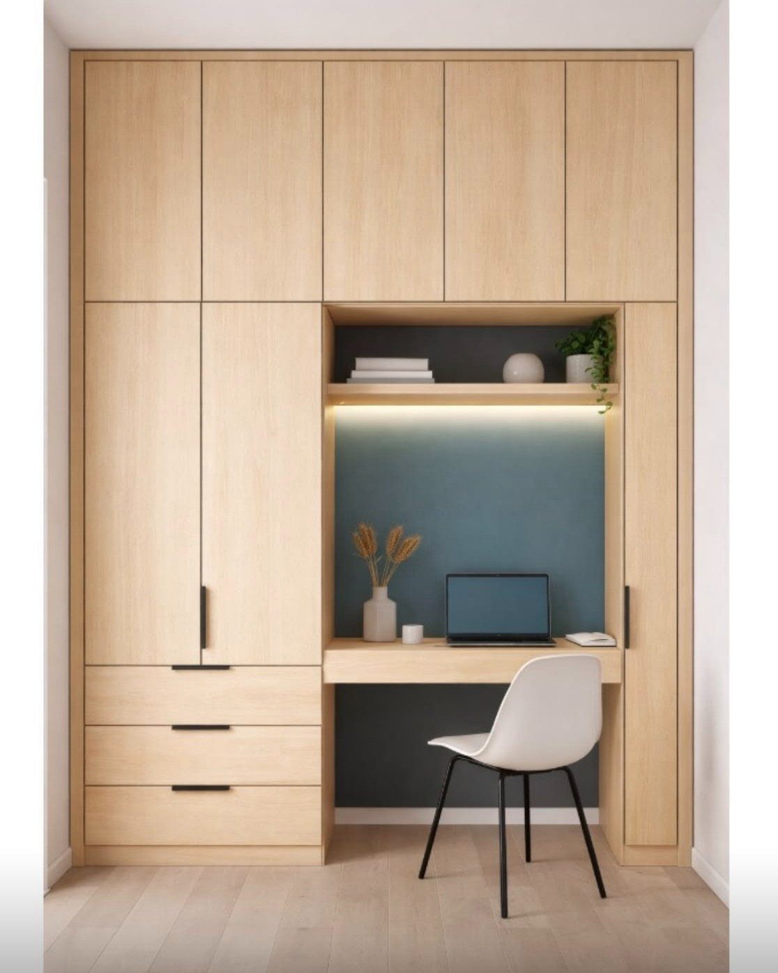 Built-in light wood wall unit with a desk nook and integrated storage cabinets.
