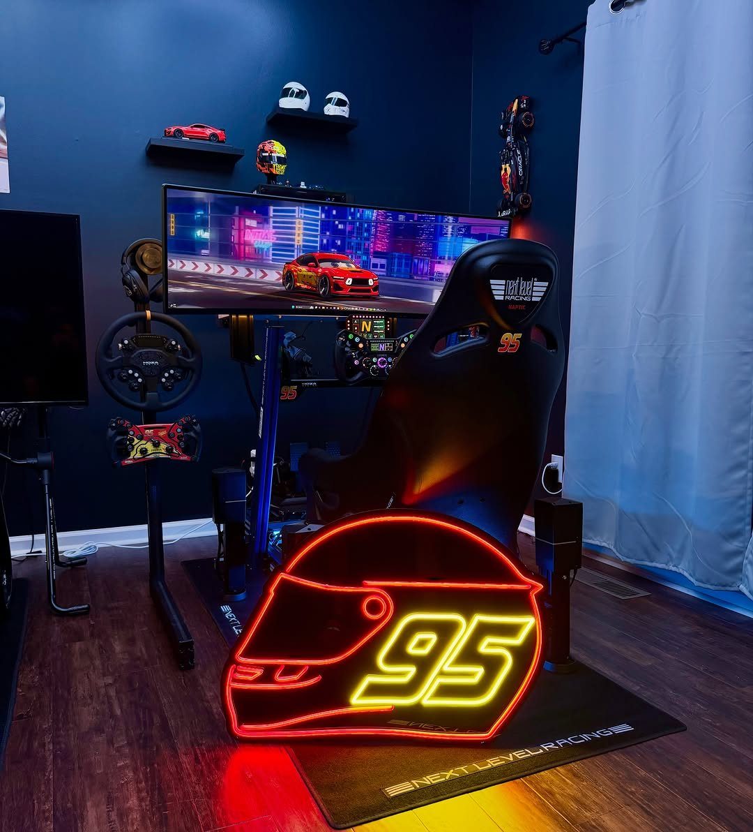 Racing helmet neon sign in front of a professional gaming racing simulator setup