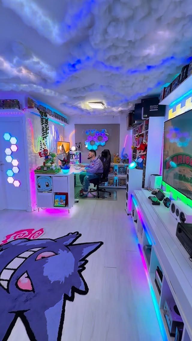Gaming room with cloud ceiling, Gengar rug, and colorful RGB lighting setup.
