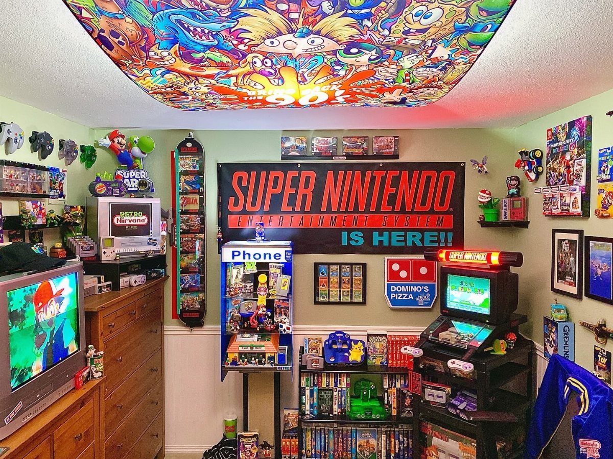 Gaming room with a retro arcade machine, Super Nintendo banner, and ceiling mural.