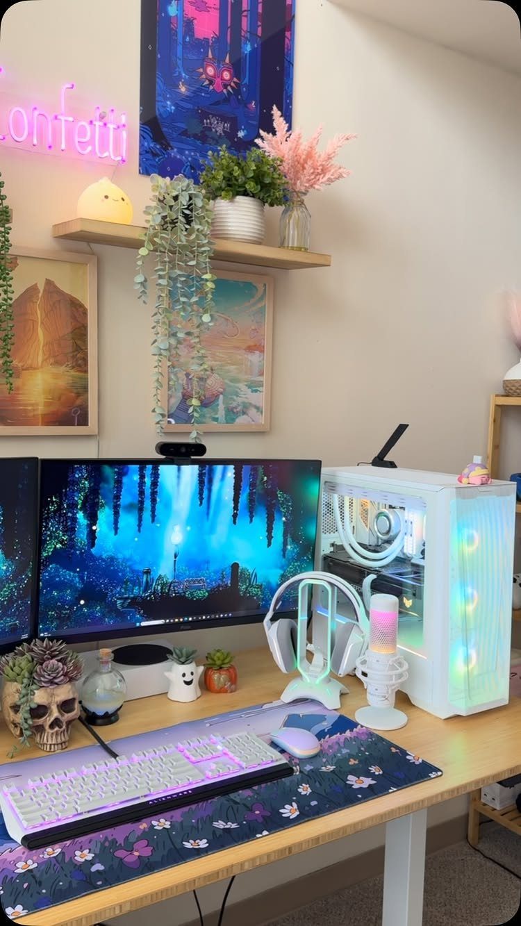 White gaming PC and peripherals on a desk with plants and neon lighting.