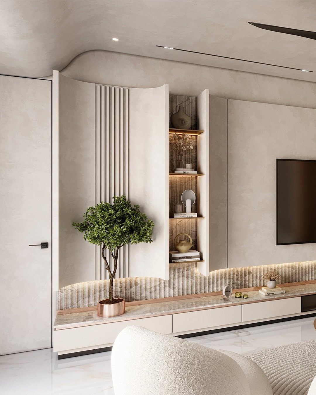 Curved beige wall panel with integrated shelving and a floating white TV console.