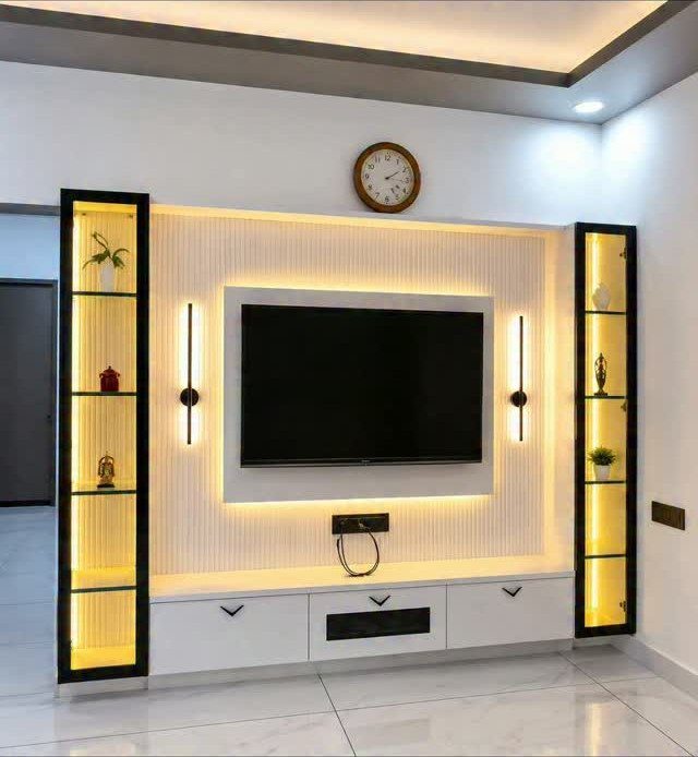 Modern drawing room TV panel with fluted white walls and yellow LED lighting.