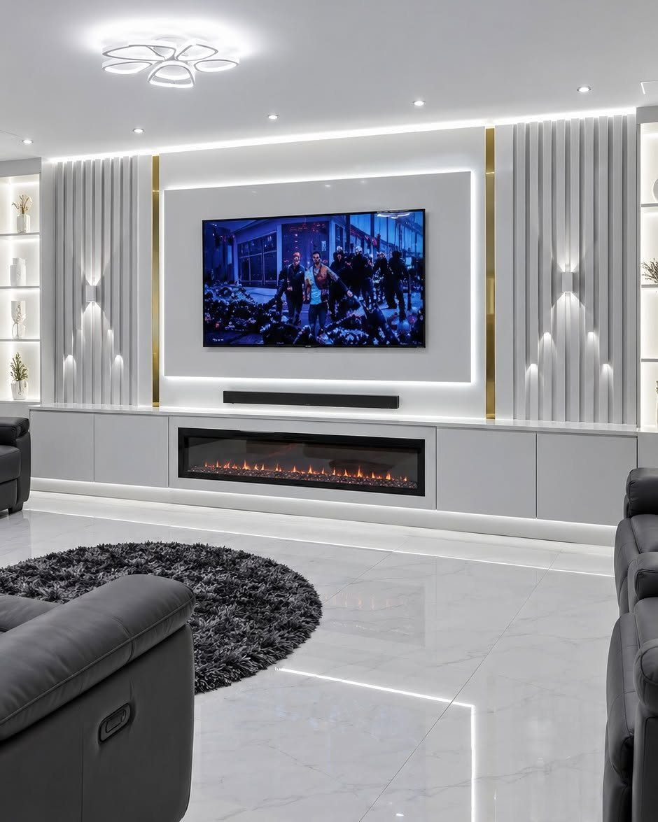 Modern white TV wall panel with gold metallic accents and integrated electric fireplace.