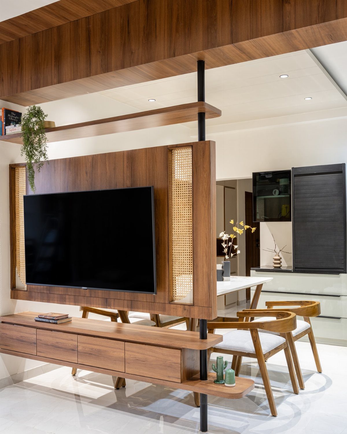 Wooden TV partition wall with woven cane panels and a floating lower cabinet.